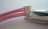 Poser l'attache pince cordon du bracelet Poser l'attache pince cordon du bracelet